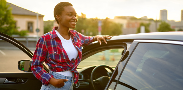 Woman smiling near car